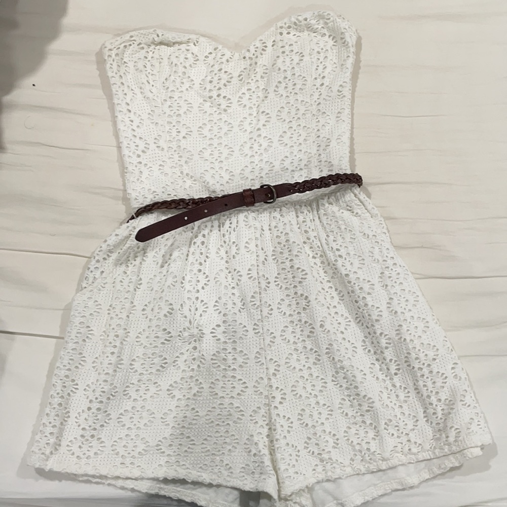 White romper with brown braided belt